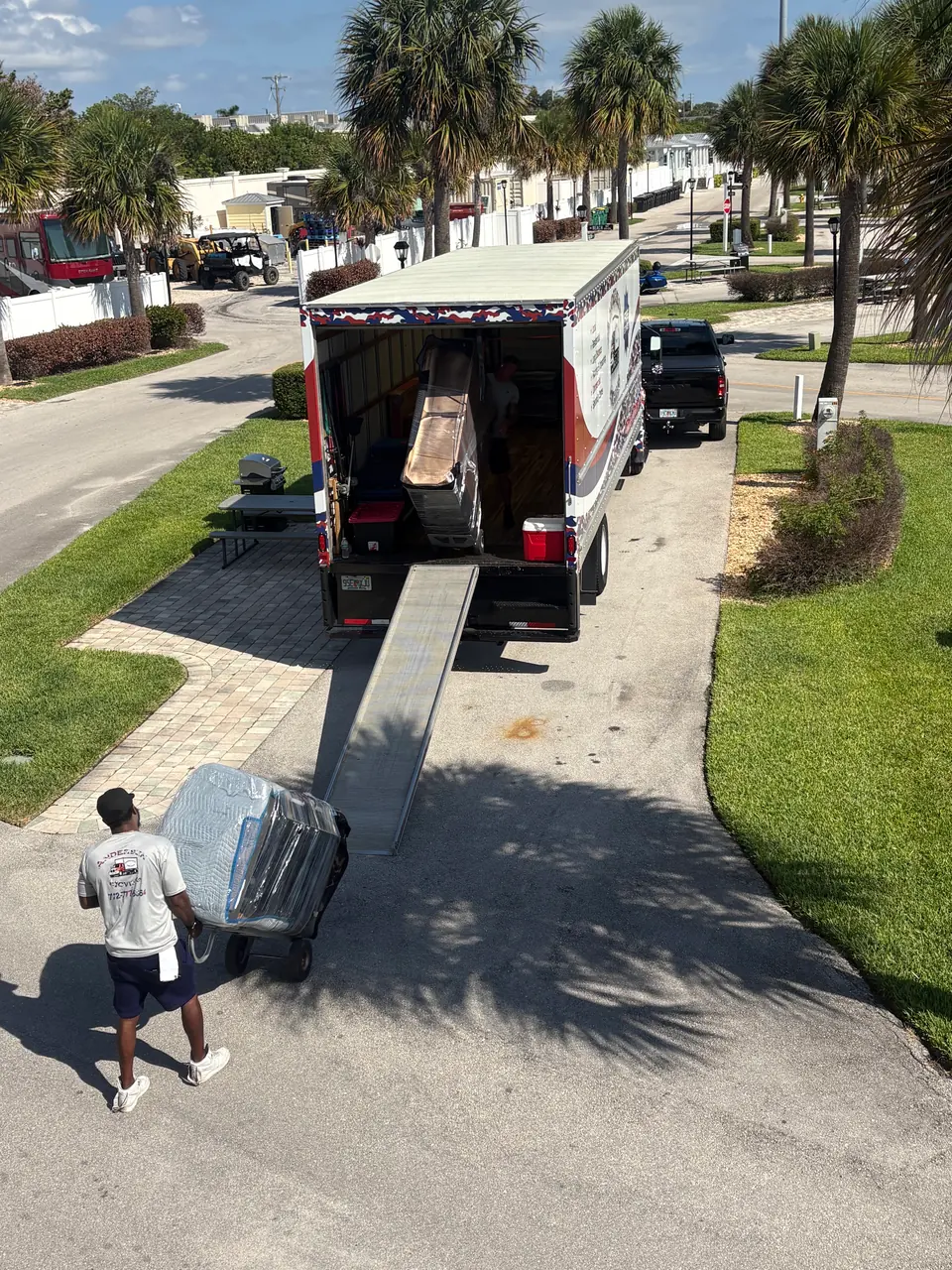 Andersen Moving crew unloading a truck at a Palm City community